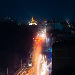 Boudhanath stupa and Boudha Road at night in Nepal. 