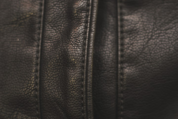 Stitches in black leather