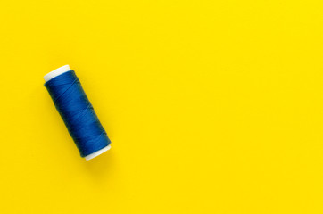 spool of thread on paper background