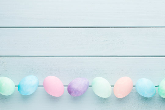 Pastel Easter eggs background. Spring greating card.