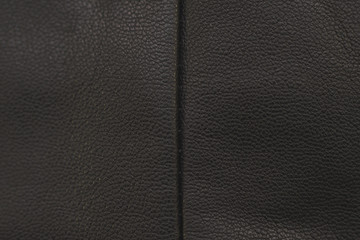 Stitches in black leather