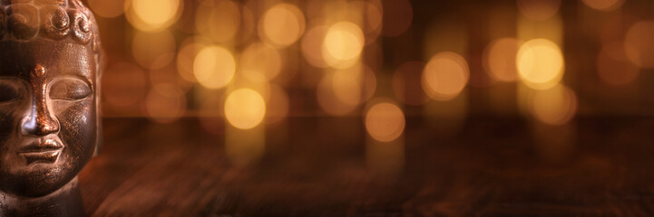 Buddha head on bokeh background