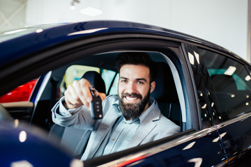 Excited man happy because of buying a new car.