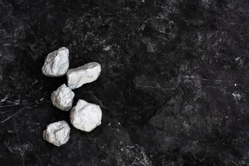 lump of silver or platinum on dark wood background