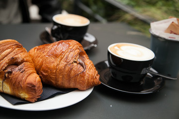 Croissant with chocolate and cappuccino 