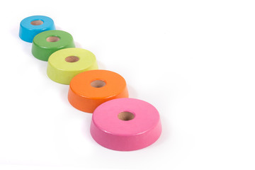 The schedule of children's wooden rings. Increase or decrease circles with different sizes and colors. Chart, list, indicators, enumeration. Place for text. Real business presentation concept.