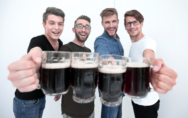 close up.mugs of beer in the hands of the fans.