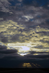 Dark sky clouds cloudscape over the sunset