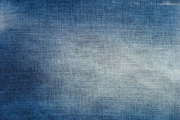 Faded blue jeans texture background