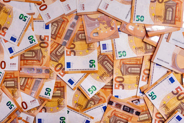 50 euros. Fifty euro notes as a background.