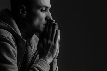 Man praying hands hoping for best. Human emotion facial expression feeling. Prayer, people, church.