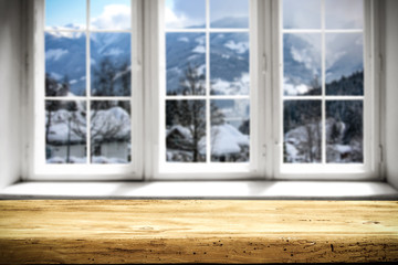 Table background and window of winter landscape 