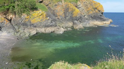 The beautiful, clear, blue-green sea at the popular Cornish travel destination of Cadgwith Cove.
