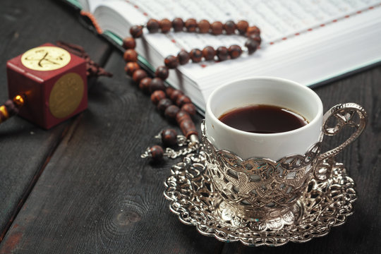 The Open holy Quran with tasbih/rosary beads close up