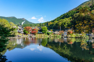 Fototapeta na wymiar Yufuin, Oita, Japan - November 1 2017 : The Kinrin Lake with Mount Yufu in Background and blue sky with clouds in autumn. onsen town, Yufuin, Oita, Kyushu, Japan