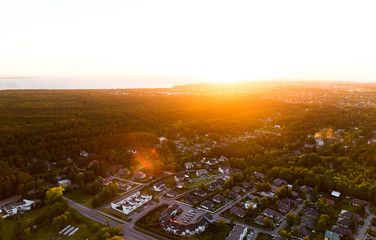 drone photography concept - aerial view of suburban houses near forest in estonia