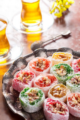 various pieces of turkish delight lokum and black tea