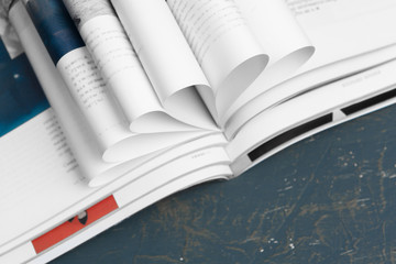 Close up stacking magazine place on table background
