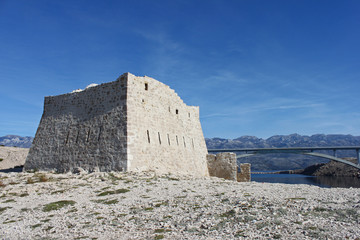 Fototapeta na wymiar Ruins of fortica on island of Pag (Croatia).