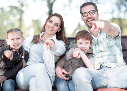 Close Up.happy Family Pointing At You