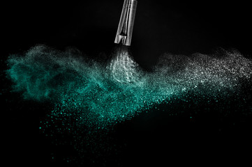 Deep ocean powder color splash and silver brush for makeup artist or beauty blogger in black...