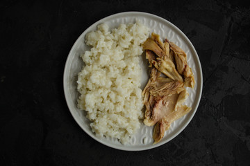 rice and boiled chicken meat. proper nutrition. food background. copy space