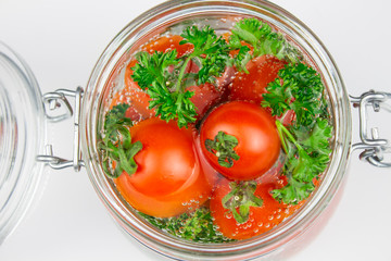 A variety of canned products in glass jars - tomatoes, cucumbers, Brussels sprouts, broccoli. Preservation of vegetables and fruits. canning. Preservation of the harvest. isolate
