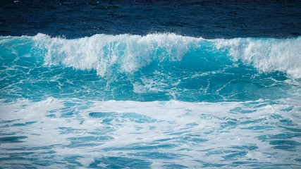 Large turquoise wave in the sea. Lanzarote, Canary Islands.