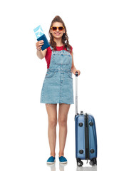 tourism, summer holidays and vacation concept - happy teenage girl in sunglasses with travel bag and air ticket over white background