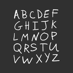 Vector alphabet letters, white chalk written on dark blackboard.