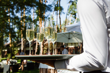 Glasses with champagne at a wedding outdor