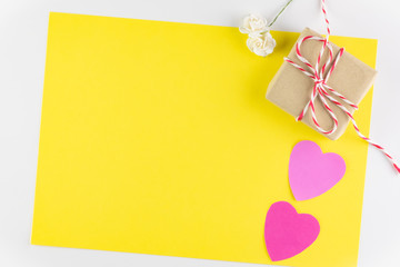 Gift box and Hand-made pink love hearts isolated on yellow texture background, Happy valentine's day. holiday background, Flat lay, top view, copy space