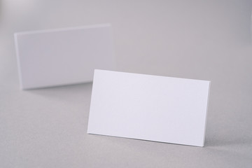 Business cards on the desk top.