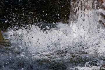 Naklejka na ściany i meble closeup waterfall splash