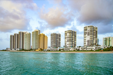 Fototapeta na wymiar empty beach at Sunny isles beach, Miami in early morning with skyscraper
