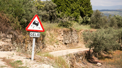 Warning icy road sign on a road of Portugal
