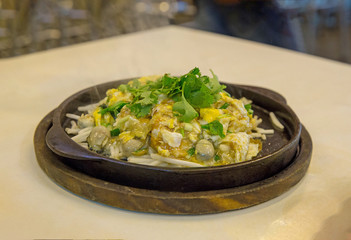 Oyster Omelette Served on Hot Pan, Chinese Food in Thailand.