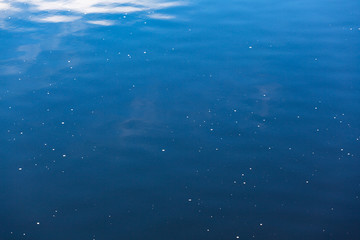 Fototapeta na wymiar Reflection of the sky on shallow water