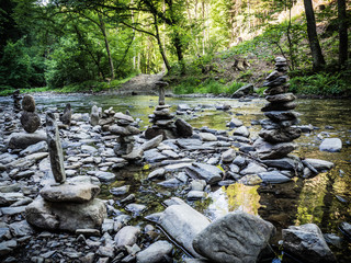 Stacked stones in the middle of stream