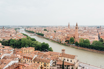 Fototapeta na wymiar Panoramic view of Verona city and Adige river, Italy. Aerial view