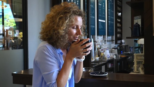 Girl Smelling Coffee Aroma In Cafe.