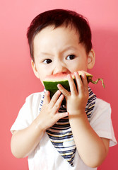 Closeup Asian child eating watermelon