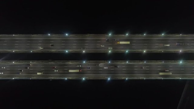 Aerial Over Head View Of Night Traffic At Bridge. Static Shot. Highway Road In Saint-Petersburg.