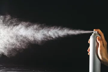 Foto op Aluminium Spraying the aerosol from the spray © zaharov43