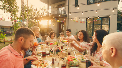 Big Family Garden Party Celebration, Gathered Together at the Table Relatives and Friends, Young...