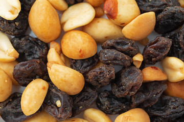 Close view of a portion of peanuts and raisins.