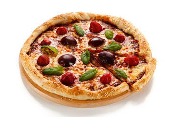 Pizza with plums and strawberries on white background
