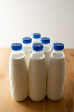 milk bottles on wooden table