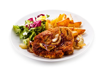 Fried pork chop with potatoes on white background