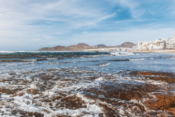 Ocean coast, waves, rocks. Tropical island, a place to relax. Canary Islands.